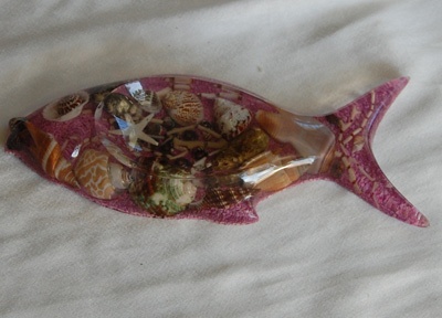 shell disc art with fish ornament
