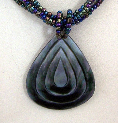 black mop necklace carved