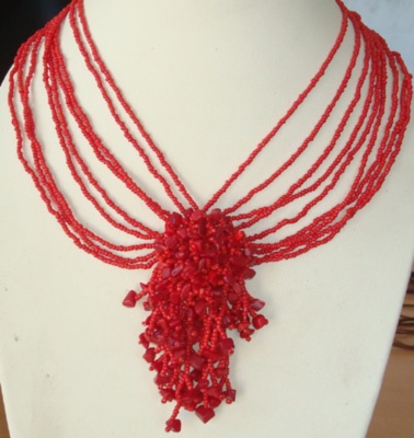 red bead necklace art