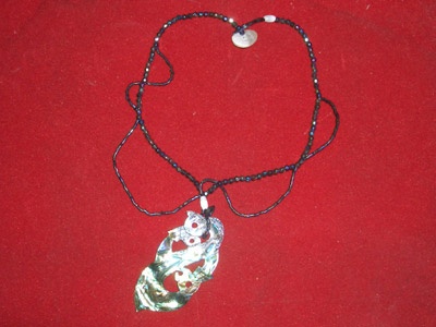 Necklace carving from paua shell