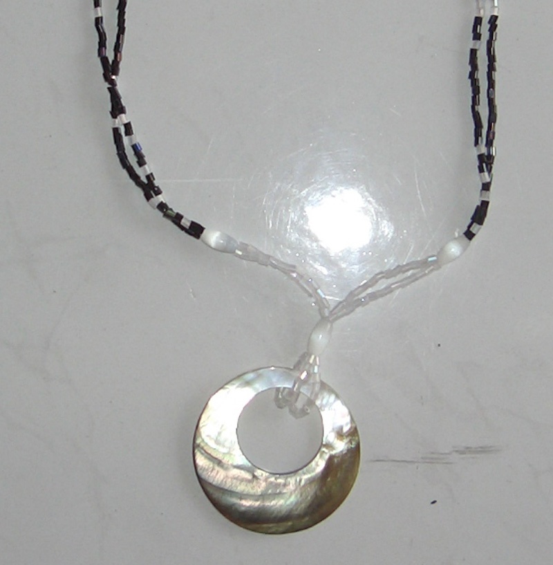 Necklace black shell hole aroud