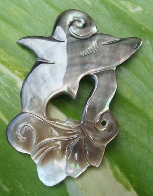 shell carving art dolphin